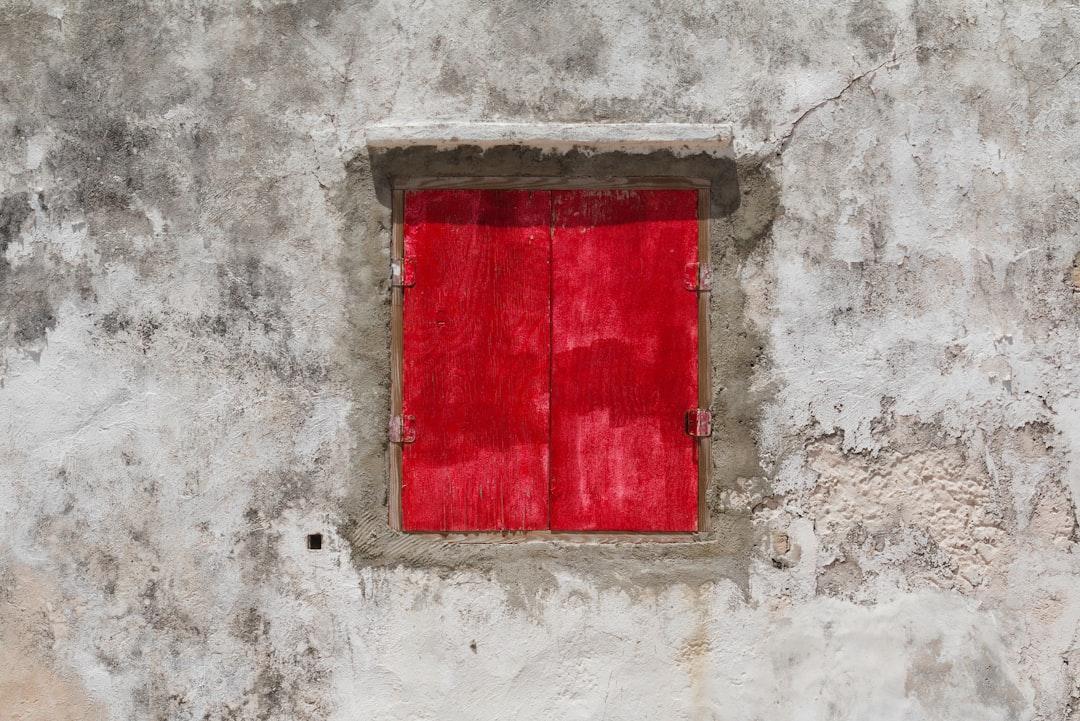 A red window on an old house on the southern tip of Bonaire.