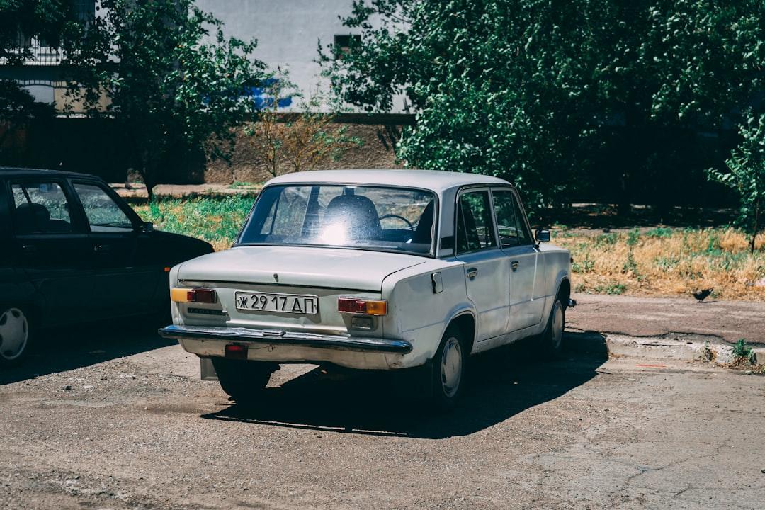 Old White Lada in Ukraine during summer.