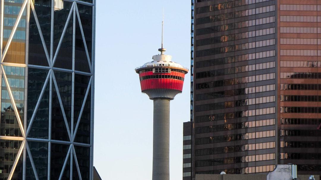 The Calgary Tower between skyscrapers.