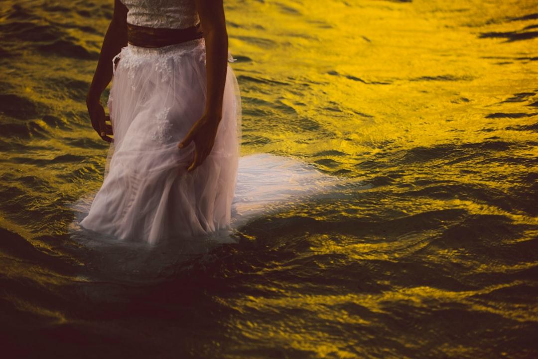 From a wedding i shot in Rarotonga. The bride had purposefully planned to have a ‘trash the dress’ shoot and the water was sooooo warm! Shot after sunset when the sky glow was still bright enough. Love the mustard tones on the water too.